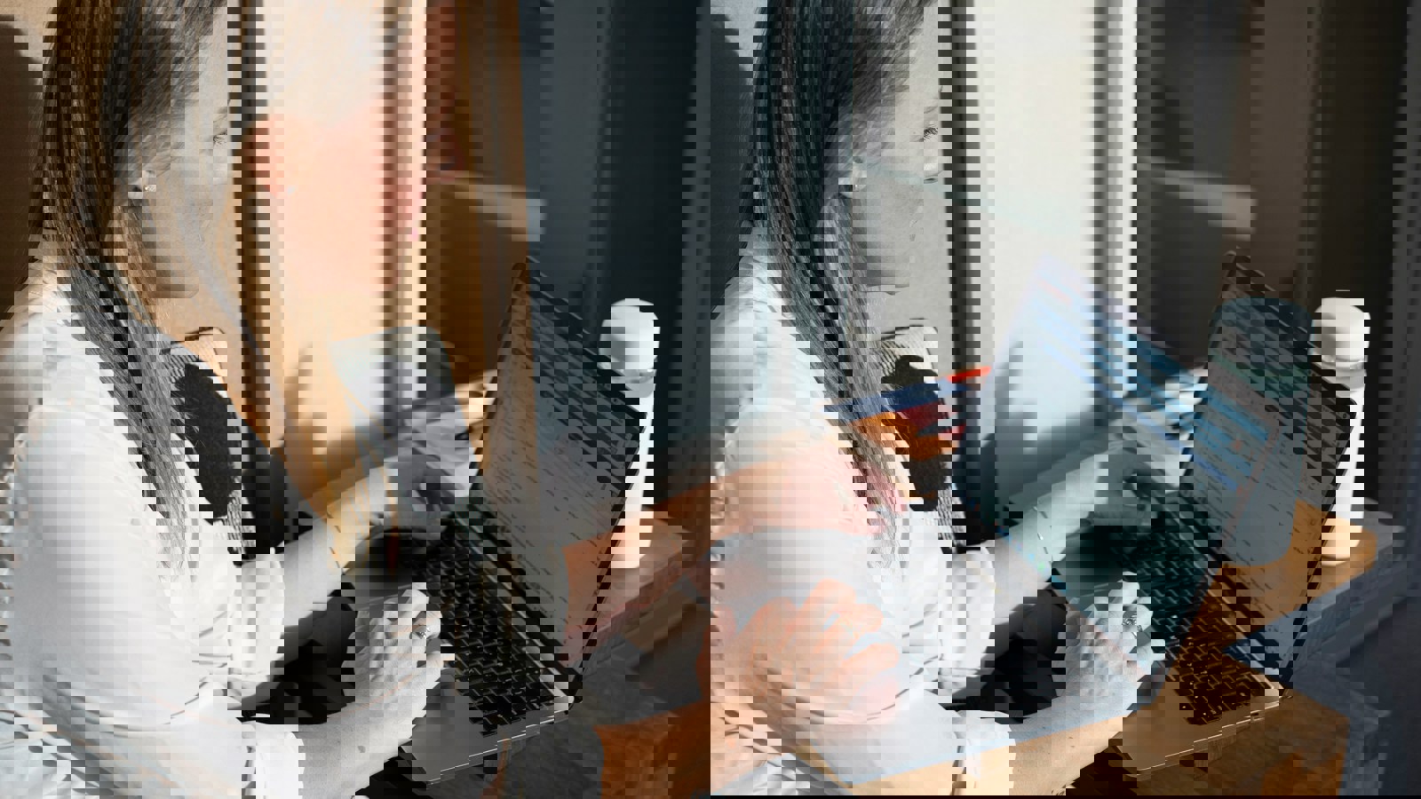 A lady sitting looking at a computer